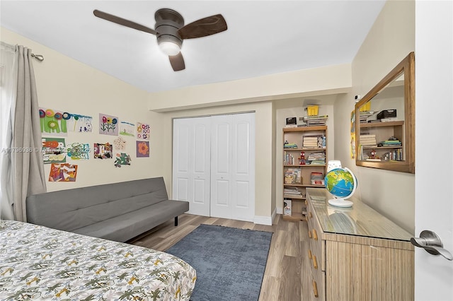 2221 N 46th Ave, Hollywood, FL 33021 - bedroom featuring light wood-style flooring, a closet, and a ceiling fan