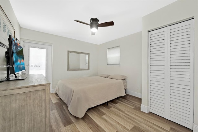 2221 N 46th Ave, Hollywood, FL 33021 - bedroom with baseboards, wood finished floors, ceiling fan, and a closet