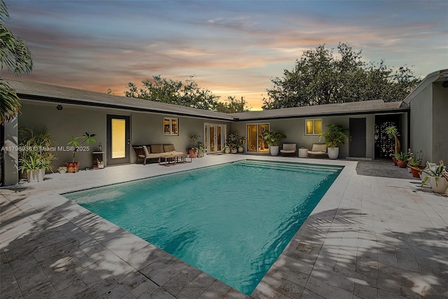 2221 N 46th Ave, Hollywood, FL 33021 - pool at dusk featuring a patio area, an outdoor pool, and outdoor lounge area