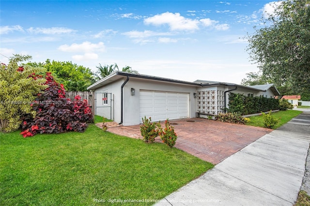 2221 N 46th Ave, Hollywood, FL 33021 - view of front facade featuring stucco siding, decorative driveway, and an attached garage