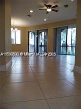 2901 NW 126th Ave Unit 2-325, Sunrise, FL 33323 - unfurnished room featuring a ceiling fan, baseboards, a chandelier, and recessed lighting