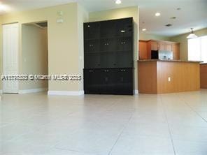 2901 NW 126th Ave Unit 2-325, Sunrise, FL 33323 - empty room featuring recessed lighting, baseboards, and light tile patterned floors