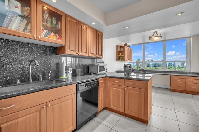 11 Island Ave Unit 512, Miami Beach, FL 33139 - kitchen featuring dishwasher, decorative backsplash, a peninsula, dark stone counters, and light tile patterned floors