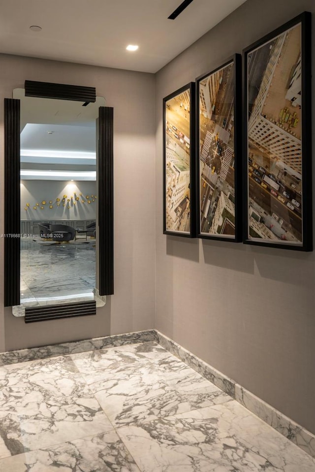 11 Island Ave Unit 512, Miami Beach, FL 33139 - spare room with marble look tiles, baseboards, and recessed lighting