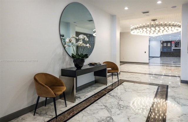 11 Island Ave Unit 512, Miami Beach, FL 33139 - hall with marble tiled floors, baseboards, inlaid floor details, recessed lighting, and arched walkways