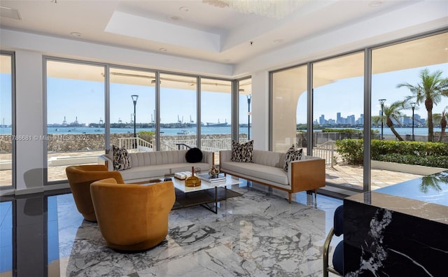 11 Island Ave Unit 512, Miami Beach, FL 33139 - sunroom / solarium featuring healthy amount of natural light, a water view, marble tiled floors, and a raised ceiling