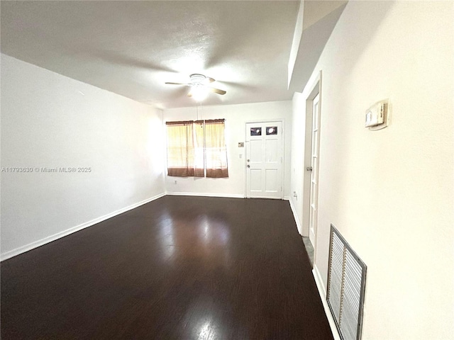 6211 NW 37th Ter, Virginia Gardens, FL 33166 - unfurnished room with ceiling fan, dark wood-type flooring, and baseboards