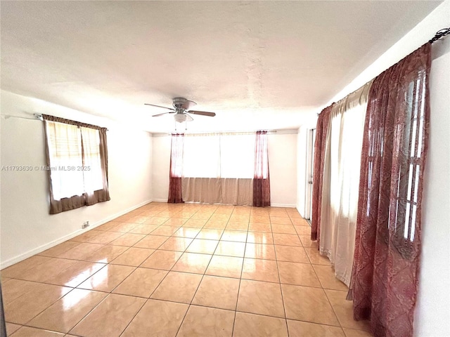 6211 NW 37th Ter, Virginia Gardens, FL 33166 - unfurnished room with healthy amount of natural light, light tile patterned flooring, ceiling fan, and baseboards