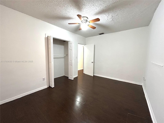 6211 NW 37th Ter, Virginia Gardens, FL 33166 - unfurnished bedroom with wood finished floors, baseboards, a textured ceiling, a closet, and a ceiling fan