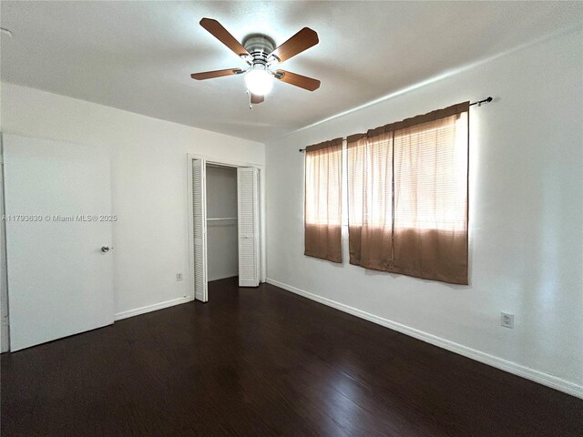 6211 NW 37th Ter, Virginia Gardens, FL 33166 - unfurnished bedroom featuring a closet, baseboards, wood finished floors, and ceiling fan