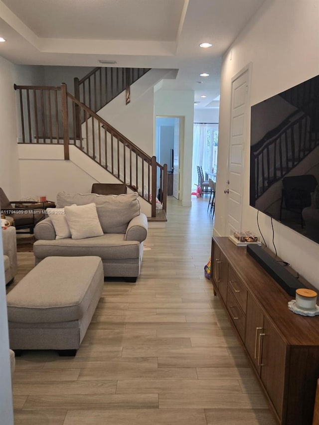 17545 SW 150th Ct, Miami, FL 33187 - living room featuring light wood-style flooring, stairway, and recessed lighting