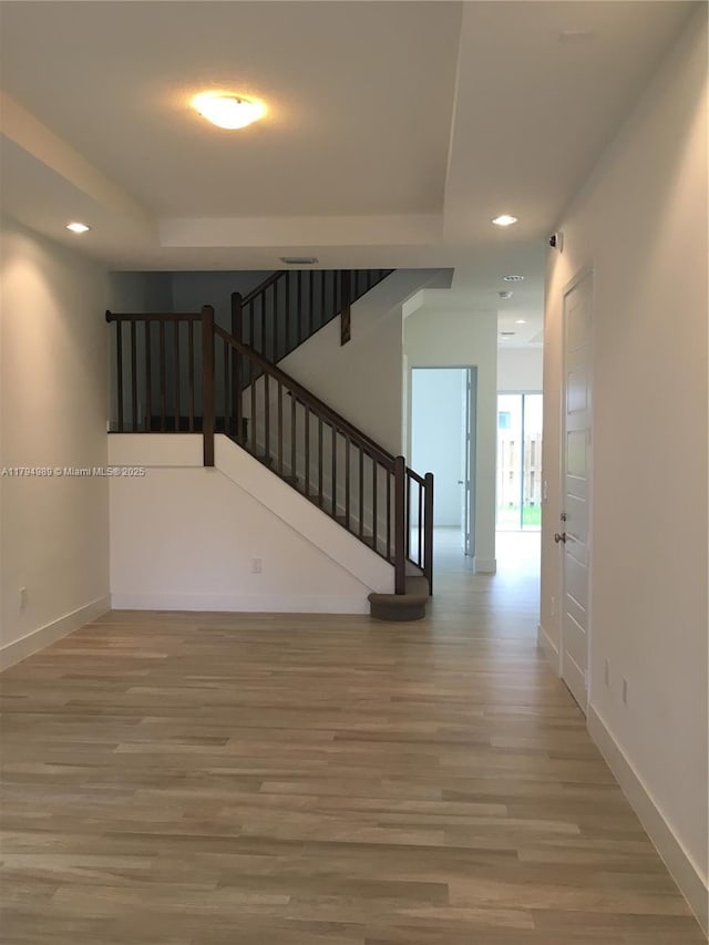 17545 SW 150th Ct, Miami, FL 33187 - staircase featuring recessed lighting, wood finished floors, baseboards, and a tray ceiling