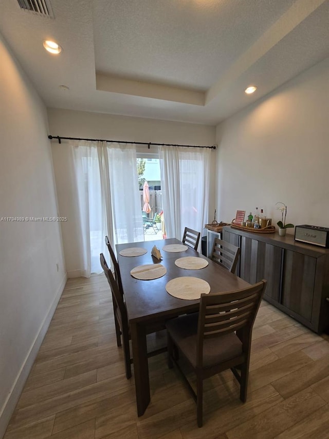 17545 SW 150th Ct, Miami, FL 33187 - dining area featuring a tray ceiling, baseboards, light wood finished floors, recessed lighting, and a textured ceiling