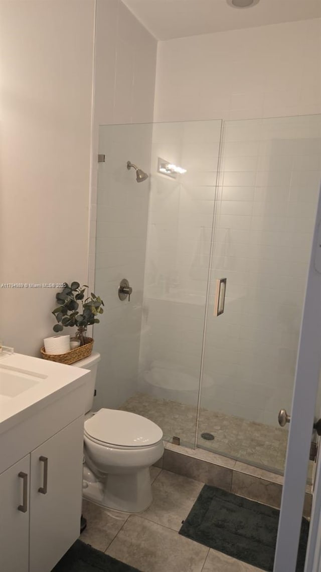 17545 SW 150th Ct, Miami, FL 33187 - full bathroom featuring a shower stall, tile patterned flooring, vanity, and toilet