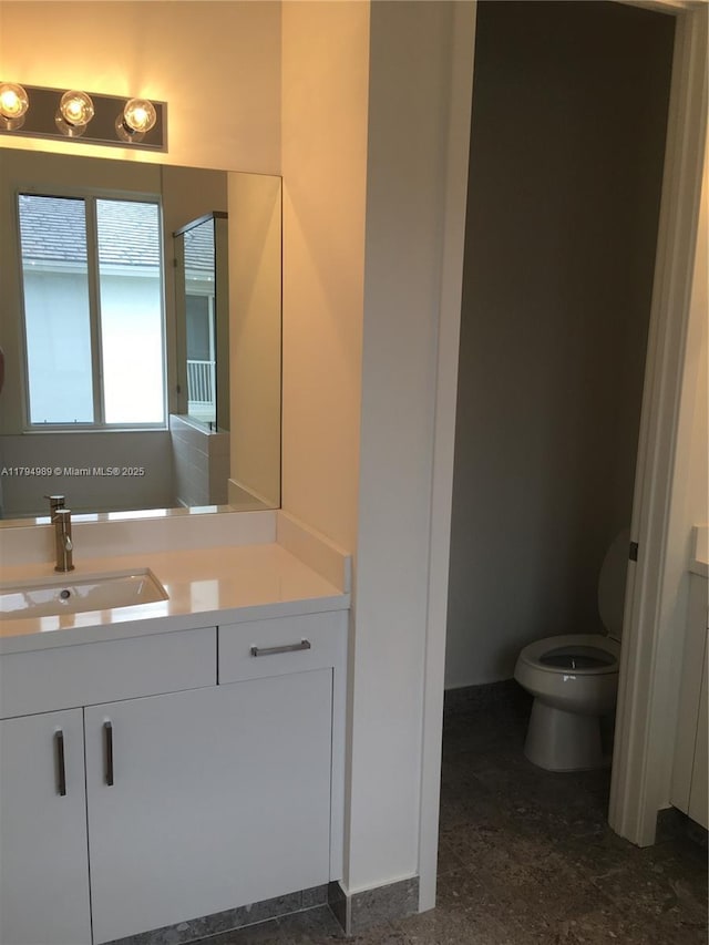 17545 SW 150th Ct, Miami, FL 33187 - bathroom featuring vanity, toilet, and baseboards
