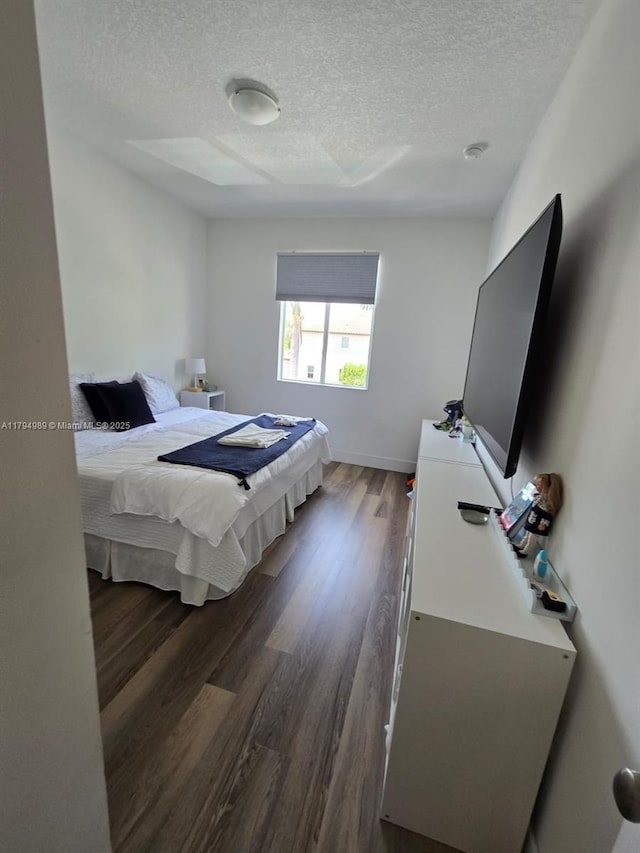 17545 SW 150th Ct, Miami, FL 33187 - bedroom with a textured ceiling, dark wood finished floors, and baseboards