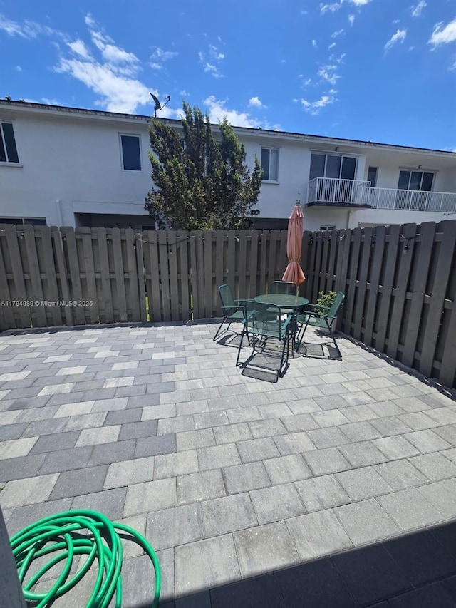 17545 SW 150th Ct, Miami, FL 33187 - view of patio / terrace with fence and outdoor dining space