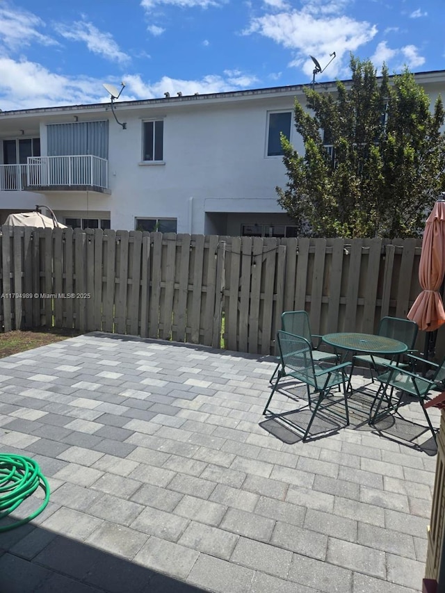 17545 SW 150th Ct, Miami, FL 33187 - view of patio / terrace featuring fence and outdoor dining area