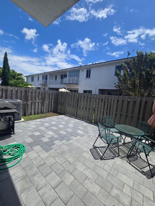 17545 SW 150th Ct, Miami, FL 33187 - view of patio / terrace with fence and central AC