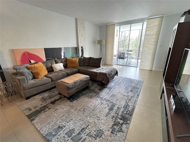 3660 NE 166th St Unit 307, North Miami Beach, FL 33160 - living room with expansive windows and tile patterned flooring