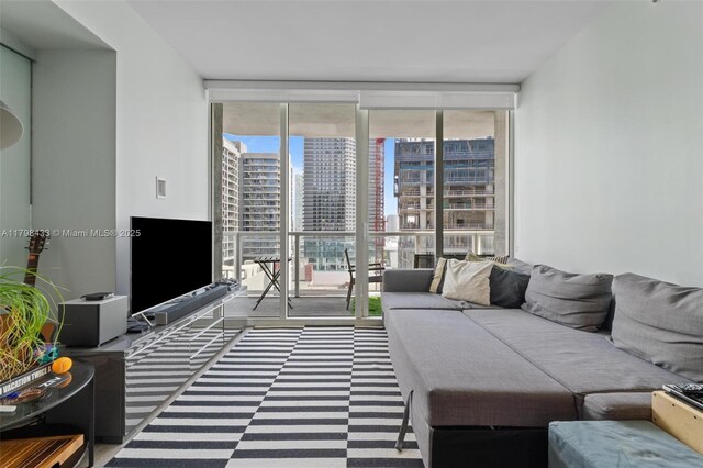 253 NE 2nd St Unit 2201, Miami, FL 33132 - living room featuring floor to ceiling windows and healthy amount of natural light
