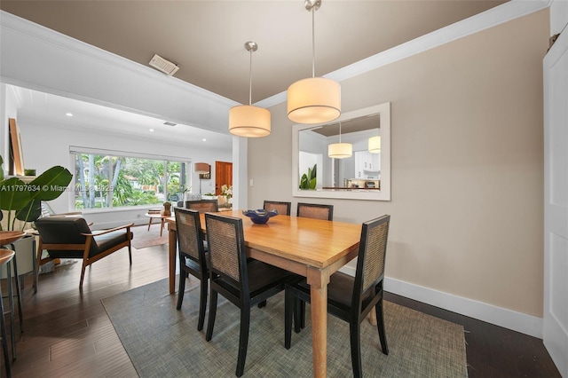 270 NE 104th St, Miami Shores, FL 33138 - dining space featuring dark wood-style flooring, baseboards, crown molding, and recessed lighting