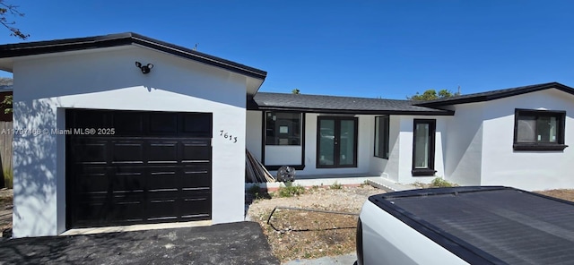 7613 Coral Blvd, Miramar, FL 33023 - ranch-style house with a garage and stucco siding