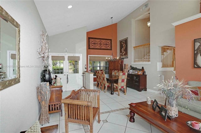 15007 SW 141st Pl, Miami, FL 33186 - tiled living area with high vaulted ceiling, a chandelier, stairway, baseboards, and french doors