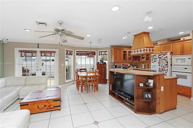 15007 SW 141st Pl, Miami, FL 33186 - living room featuring a ceiling fan, recessed lighting, ornamental molding, french doors, and light tile patterned floors