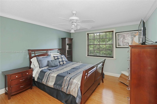 15007 SW 141st Pl, Miami, FL 33186 - bedroom with wood finished floors, a textured ceiling, crown molding, baseboards, and ceiling fan