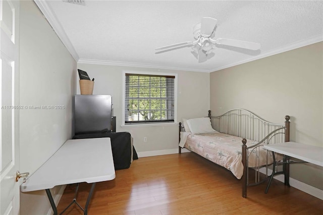 15007 SW 141st Pl, Miami, FL 33186 - bedroom with wood finished floors, baseboards, crown molding, a ceiling fan, and a textured ceiling