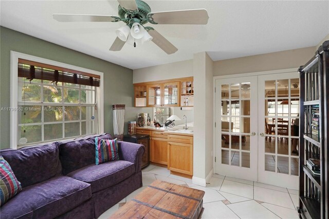 15007 SW 141st Pl, Miami, FL 33186 - living area featuring light tile patterned flooring, french doors, and a ceiling fan