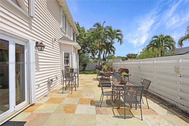 15007 SW 141st Pl, Miami, FL 33186 - view of patio with outdoor dining area and a fenced backyard