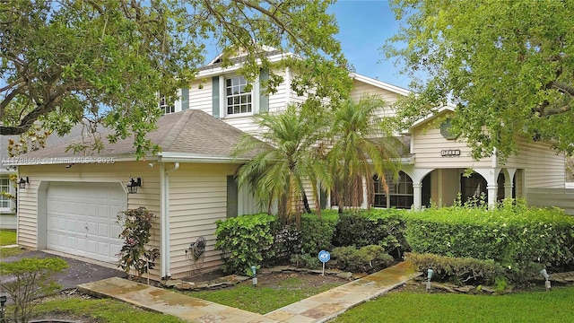 15007 SW 141st Pl, Miami, FL 33186 - view of front facade featuring a garage, asphalt driveway, and roof with shingles