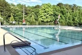 15007 SW 141st Pl, Miami, FL 33186 - community pool featuring a forest view