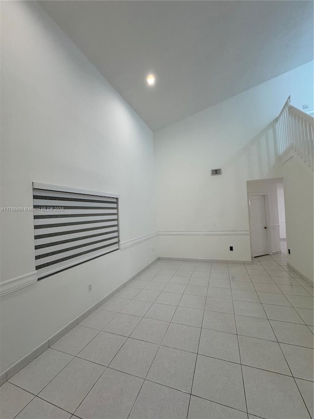 10331 SW 20th Ter, Miami, FL 33165 - empty room featuring light tile patterned floors, high vaulted ceiling, recessed lighting, and baseboards
