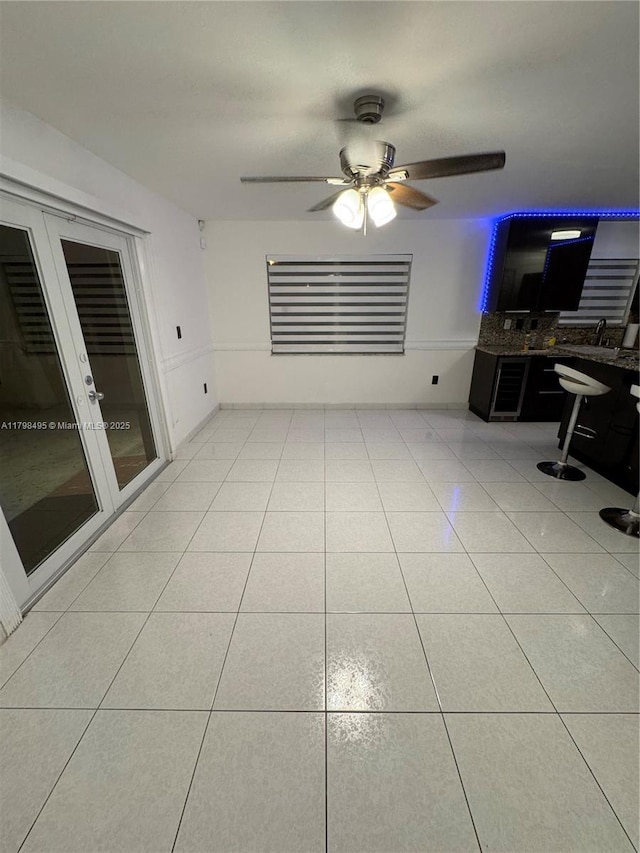 10331 SW 20th Ter, Miami, FL 33165 - unfurnished living room featuring a ceiling fan, light tile patterned flooring, and a desk