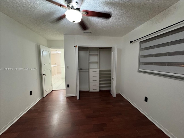 10331 SW 20th Ter, Miami, FL 33165 - unfurnished bedroom with a textured ceiling, dark wood-type flooring, a closet, baseboards, and a ceiling fan