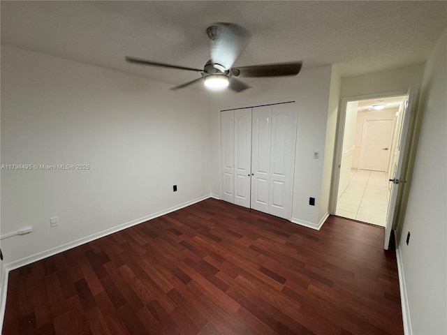 10331 SW 20th Ter, Miami, FL 33165 - unfurnished bedroom featuring dark wood-style floors, baseboards, a closet, and ceiling fan