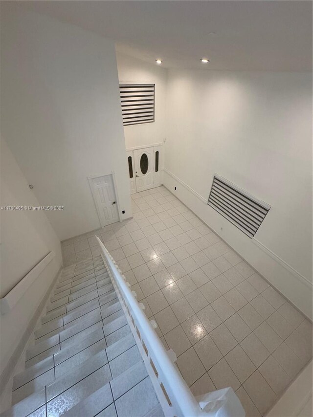 10331 SW 20th Ter, Miami, FL 33165 - unfurnished living room featuring tile patterned floors, recessed lighting, and baseboards