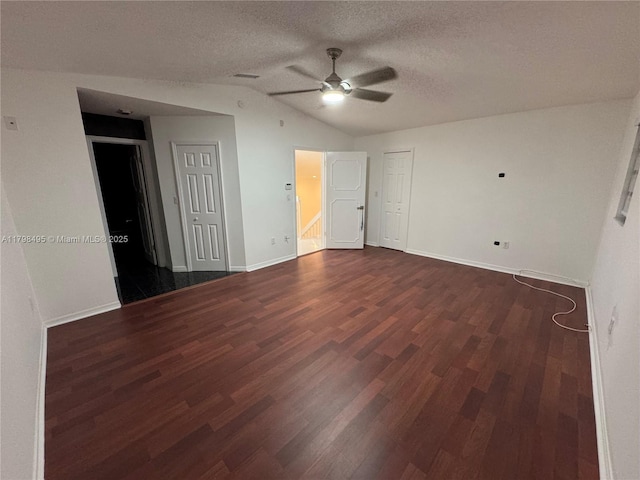 10331 SW 20th Ter, Miami, FL 33165 - spare room featuring ceiling fan, vaulted ceiling, dark wood-style floors, baseboards, and a textured ceiling