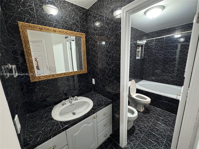 10331 SW 20th Ter, Miami, FL 33165 - bathroom with tile walls, a bidet, vanity, toilet, and tiled shower / bath