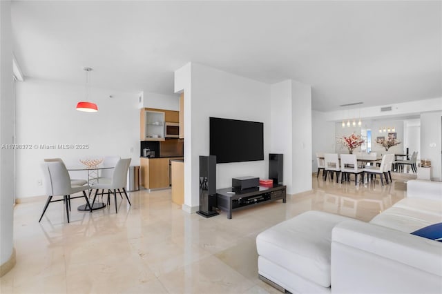 6365 Collins Ave Unit 3202, Miami Beach, FL 33141 - living room featuring light marble finish flooring