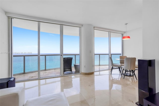 6365 Collins Ave Unit 3202, Miami Beach, FL 33141 - living room with floor to ceiling windows and a water view