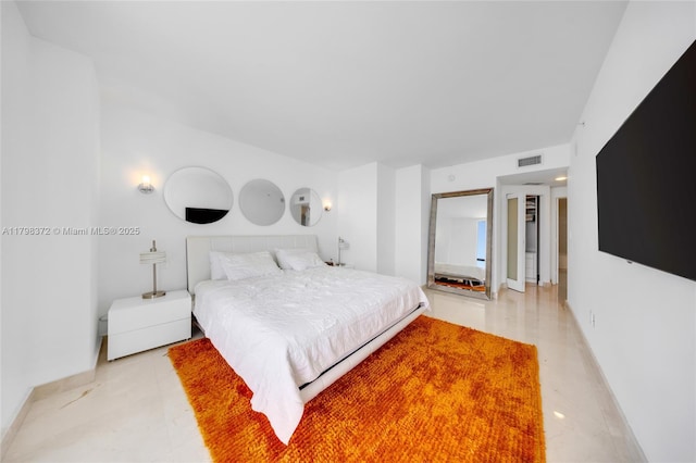 6365 Collins Ave Unit 3202, Miami Beach, FL 33141 - bedroom with baseboards and light tile patterned floors