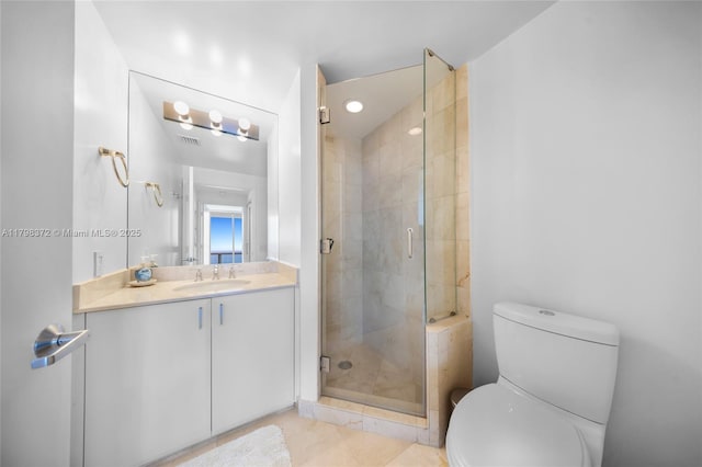 6365 Collins Ave Unit 3202, Miami Beach, FL 33141 - full bathroom with a shower stall, toilet, vanity, and tile patterned floors