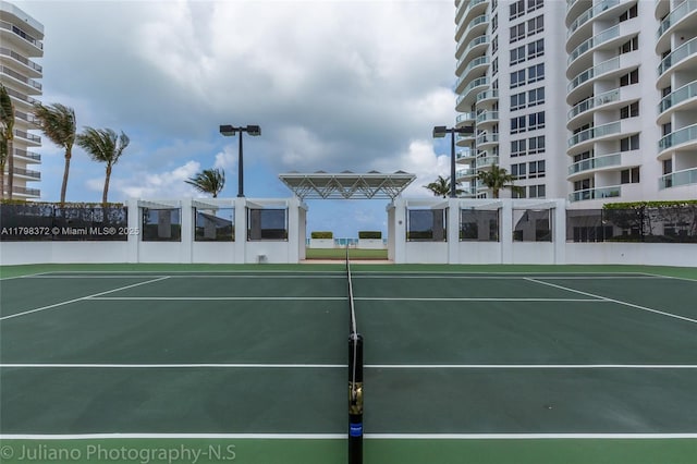 6365 Collins Ave Unit 3202, Miami Beach, FL 33141 - view of tennis court with fence and community basketball court