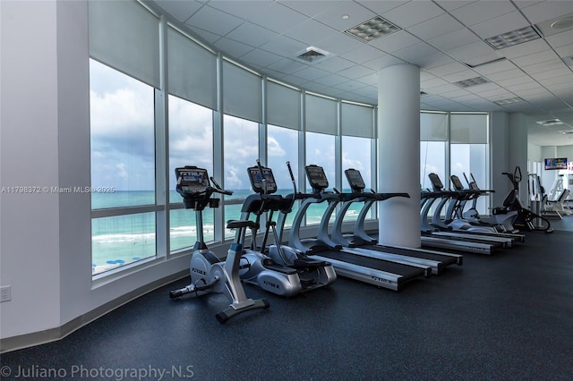 6365 Collins Ave Unit 3202, Miami Beach, FL 33141 - exercise room with a drop ceiling and a water view