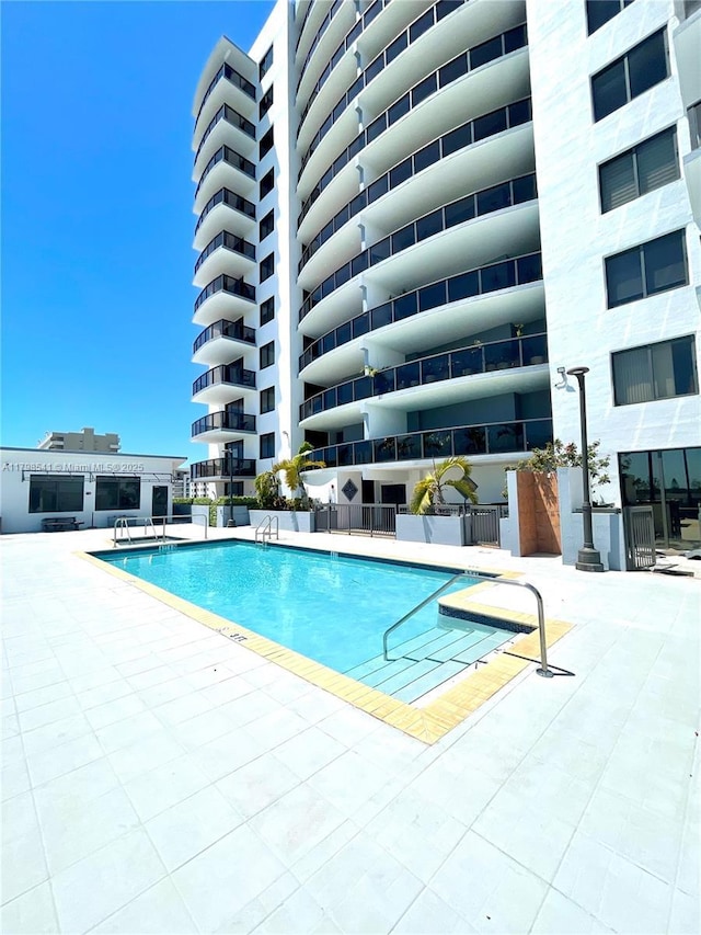 2301 SW 27th Ave Unit 802, Miami, FL 33145 - community pool with a patio area and fence