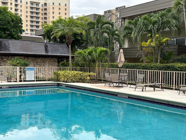 8335 SW 72nd Ave Unit 202D, Miami, FL 33143 - community pool featuring fence and a patio